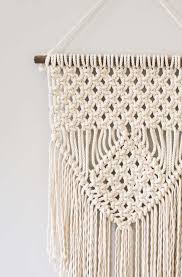 Add beads to your macrame wall decor to give this simple macrame design a lovely contrast to your bare wall. Learn Three Basic Macrame Knots To Create Your Wall Hanging