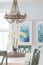 Blue And White Coastal Dining Room With Images Coastal Dining Room Dining Room Chandelier Wood Dining Room