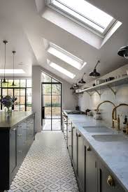 Clean Kitchen With Sloped Ceiling With Skylights And Interesting Tile Floor With Images Kitchen Ceiling Lights Best Kitchen Lighting Home Decor Kitchen