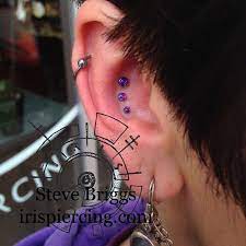 A Beautiful Placed Triple Conch Piercing With Descending Opals From Neometal Piercer Steve Briggs Studio Triple Conch Piercing Body Jewerly Body Piercing
