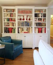 I Finally Found Time To Restyle Our Bookshelves My Collection Of White Pottery Stayed Out And I Blen White Bookcase Living Room Seating Decorating Bookshelves