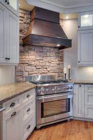 Mosaic tiles, natural stone and glass provide variation in texture and can serve as an interesting focal point for a kitchen with white cabinets. Creative Kitchen Decor Ideas White Cabinets Stone Ideas Kitchen Backsplash Designs Corner Stove Kitchen Design