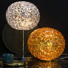 Buffet lamps, designed with slender profiles, are a perfect way to add accent lighting to your sideboard in the dining room or even a narrow table in your entryway. Buy Kartell Planet High Table Lamp Crystal Amara