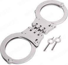 Each wing section comprises an arcuate bow portion and a shackle portion which pivots about a pivot pin holding the two sections together. Tch Handcuffs Hinge Varusteleka Com