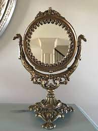 With a glimmering bronze finish, this mirror adds a sophisticated touch to a dresser, desk, or makeup vanity. Vintage Iron Art Art Nouveau Cast Iron Vanity Mirror Ornate Etsy Iron Art Vintage Iron Mirror