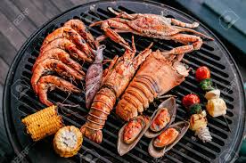 The recipes below include salmon, shrimp, scallops, tilapia, cod, and tuna. Lobster Rock Lobster And Mix Seafood Barbecue Cooking On Grill Seafood Dinner Party Concept Stock Photo Picture And Royalty Free Image Image 129547960