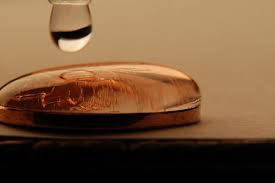 5 10 The Cohesive Properties Allow The Water To Collect On Top Of This Penny By Using Surface Tension Cool Experiments Common Core Science Surface Tension