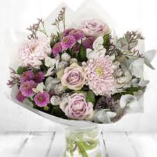 Frosted Pink A Gorgeous Bouquet Of Soft Pink And Mauve Blooms Accompanied By Frosted Pine Cones And Silvery Christmas Flowers Flowers Delivered Pink Christmas