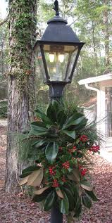 What Could Be Prettier Simpler Magnolia Leaves Berries And Pine On Lamppo Christmas Decorations Diy Outdoor Outdoor Christmas Outdoor Christmas Decorations