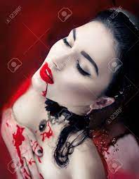 Halloween. Sexy Vampire Woman Lying In A Bath Full Of Blood Stock Photo,  Picture and Royalty Free Image. Image 64914319.