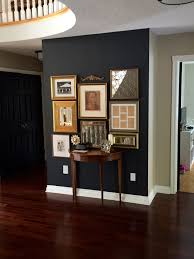 Benjamin Moore Wrought Iron Gallery Wall With Gold Frames Black Accent Wall Living Room Accent Walls In Living Room Dining Room Paint