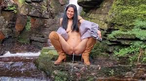 Naked in nature and peeing