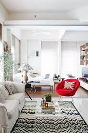 The Living Area Is Furnished With A Beige Sofa Red Accent Chair And Feathered Lamp From Dimensione Living Room Chair Decor Living Room Chairs Living Room Diy