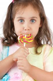 Girl Eating Candy Stock Photos and Images