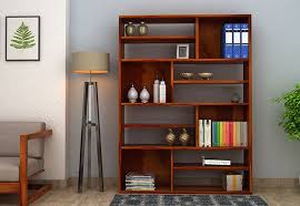 This design consists of shelves of different lengths and breadths that are spaced all over the wall. Latest Wooden Showcase Design An Excellent Storage And Decorative Unit