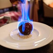 Henri Charpentier S Chocolate Dome Encapsulating Strawberry Slices Almond Biscuits Flambe With Straw Molecular Gastronomy Fancy Desserts Gourmet Desserts