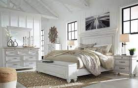 Below, the traditional turned legs effortlessly draw the eye, which is lightly finished in a distressed look and wire brushed for timeworn appeal. Kanwyn Whitewash Bedroom Set Speedyfurniture Com