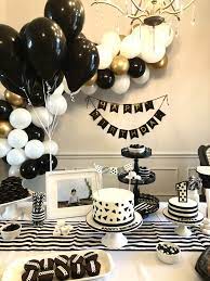 A black and white floor is a good place to start decorating with black and white. Black White One Year Party Black And White Balloons White Party Theme Birthday Themes For Boys