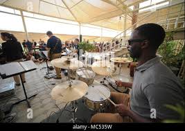 Air Force Staff Sgt. Quincy Garner of Acton, Mass., plays "Taps" in memory  of Sen. Edward Kennedy prior to a baseball game between the Boston Red Sox  and the Chicago White Sox