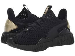 Black And Gold Tennis Shoes Womens Puma Defy Varsity Puma Black Metallic Gold Women S Shoes Find Your Stride In A Style That S Sporty And Cozy Slip On Sneakers Black Slip On Sneakers Sneakers