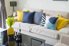 Sunny shades of yellow create bright, happy living room color schemes. Modern Pattern Blue And Yellow Cushion On Grey Sofa In Living Stock Photo Picture And Royalty Free Image Image 110446131