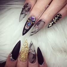 Acrylic Black Almond Shaped Nails Almond Shaped Nail With Black Gel Polish Black Matte Floral Art Over Clear Acrylic Nails Gold Glitter And Crystal Beautiful Nails Nail Designs Luxury Nails