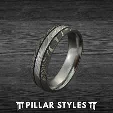 Maybe you love rock 'n' roll and love alternative metals… like rocks! Damascus Steel Ring Gunmetal Grey Mens Wedding Band Style Wedding Bands
