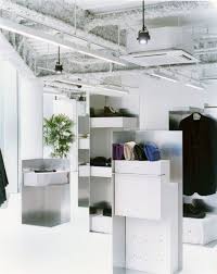 Store Interior Design For The Fashion Designer Julien David Materials Floor Concrete White Pai Interieur Boutique Maison Minimaliste Interieur Minimaliste