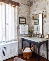 Brushed nickel shower head with digital shower valve, victoria and albert bathtub, curbless shower with hidden shower drain, flat pebble shower floor, shelf over tub with led lighting, gray vanity with drawer fronts. 25 Natural Stone Bathroom Decor Ideas Shelterness