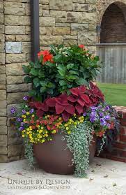 Use these colorful container garden ideas to add creative bursts of color to your landscape. 8 Stunning Container Gardening Ideas Container Gardening Flowers Large Flower Pots Container Flowers