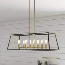 Artika Artika Carter Long Chandelier 8 Light Matte Black With Brass Accents Industrial Cage Chandelier Lowes Com In 2021 Dining Light Fixtures Dining Room Chandelier Modern Dining Room Brass Chandelier