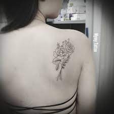 However, when flowers are designed to be the star of the show, they are often seen in a bouquet, inside a vase or having a hand holding them. Tattoo Uploaded By Mymy Tattoo Flower Flowertattoo Flowers Tattoo Tattoos Inked Triangle Bouquet Bouquettattoo Amsterdam Finelinetattoo Fineline 896313 Tattoodo