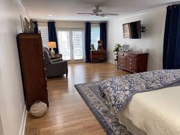 The swiss cheese plant on the floor and the banana leaf print on the wall round out the layout. How To Layout And Decorate A Long Narrow Bedroom Designed