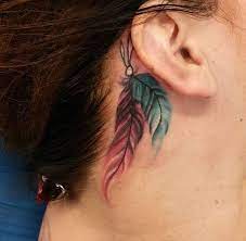 This makes it a little more personal. Feather Tat Behind Ear Tattoos Indian Feather Tattoos Cowgirl Tattoos