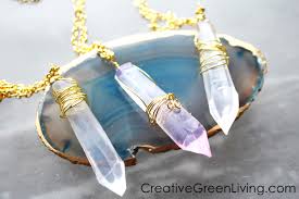 Soft yarn is crocheted around plastic beads then a length of yarn is thread through and knotted around each bead to make a necklace. Star Wars Diy Make A Kyber Crystal Necklace Creative Green Living