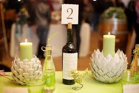 For 100 guests, $15/bottle wines will only cost a total of $700 ($15 x 46 bottles). 7 Wine Bottle Centerpieces To Diy For Your Wedding Wedpics Blog
