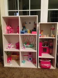 Today i wanted to share the diy doll house the hubs made our little princess. The Perfect Homemade Barbie House Shelving From Target Thumb Tacks Scrapbooking Paper Homemade Barbie House Barbie Doll House Diy Barbie House