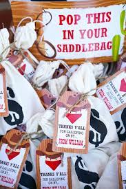 Easy decorations are made by wrapping empty {and cleaned} soup cans with plaid fabric and twine. Wild West Cowboy Themed Birthday Party Pretty My Party