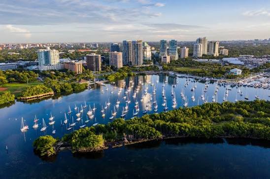 Coconut Grove, Miami's oldest neighborhood, is renowned for its lush  greenery, historic charm, and vibrant arts scene. Established in the late  19th century, it has evolved into a cultural hub featuring boutique