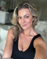 Rory McIlroy's rumoured ex Amanda Balionis reacts as she watches him win  the Masters with his wife by his side