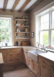 Look At This Rustic Kitchen With The Farmhouse Sink Wood Cabinets Lots Of Light And Re Country Kitchen Designs Rustic Kitchen Cabinets Rustic Farmhouse Kitchen