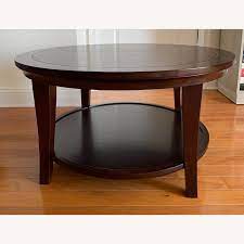 It is made of hardwood, mdf and veneer, so its solidity is very high. Pottery Barn Metropolitan Round Coffee Table Aptdeco