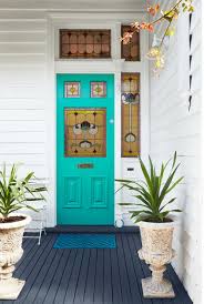 This beautiful black door reminds me of a traditional english tudor style with that adorable round door knob. Your Front Door Color Reveals More About You Than You D Think Realtor Com