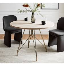 White lacquer finish over an engineered wood body. Jules Drop Leaf Expandable Dining Table