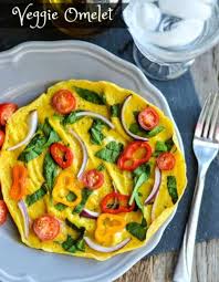 Most fluffy omelets rely on egg whites beaten into stiff peaks and then folded into a beaten egg yolk mixture gently to achieve their height. Easy Dinner Idea Veggie Omelet Recipe