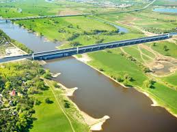 Looking down at it, the magdeburg water bridge looks like a river that passes over another river, but more than 20 feet in the air. Waterway Junction