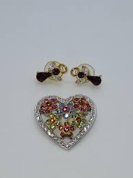 Lot 142: Joan Rivers Classic Collection Crystal Heart Brooch and a pair...