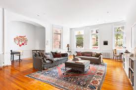 For modern apartment living room grey and yellow, white and light brown and other such combinations are popular. The Apartment Of Anne Hathaway S Modern Love Character Is For Sale Architectural Digest