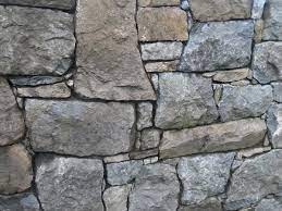 I've got a bunch of rough stone that i dug up in my garden, and i'd like to build a wall as a landscaping feature. Stone Wall Wikipedia