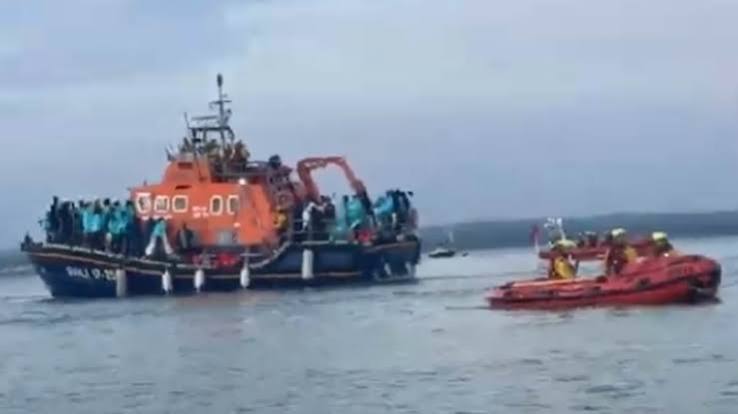 RNLI boats carrying 140 migrants were denied entry to TWO ports before they landed at docks near Portsmouth and were met by hundreds of protesters | Daily Mail Online